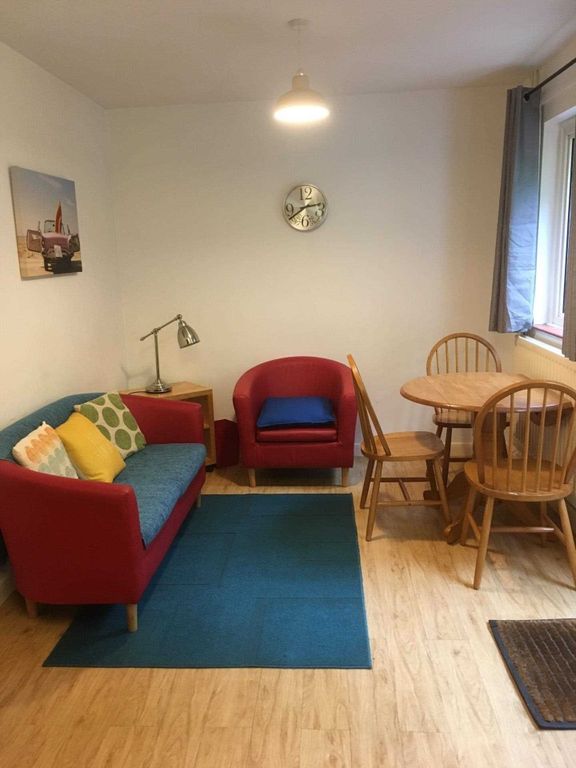 Property photo 2 of 9 Bright, Well-Kept Living Room With Colorful Seatin...