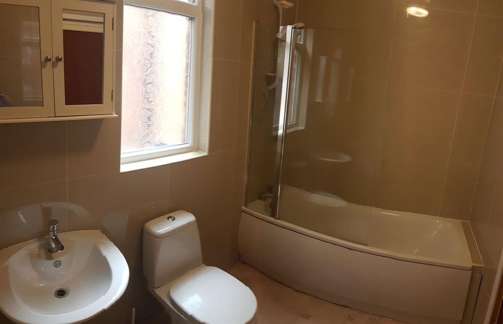 Property photo 3 of 15 Bright, Modern Bathroom With A Curved Shower-Bath,...