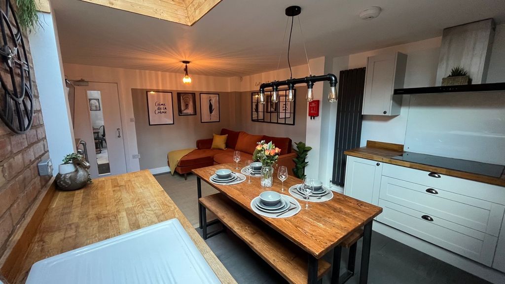 Property photo 1 of 7 A Modern And Inviting Living Room With A Comfortab...