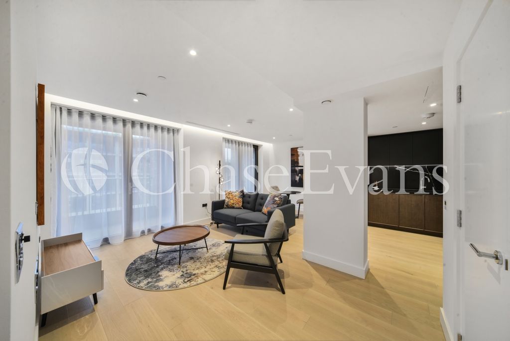 Property photo 1 of 10 Living Area - Opus H