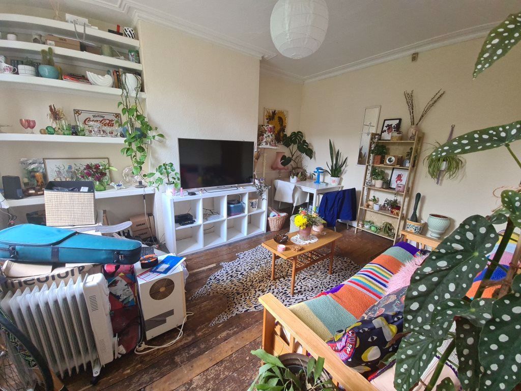 Property photo 3 of 12 A Spacious And Welcoming Living Room Filled With N...