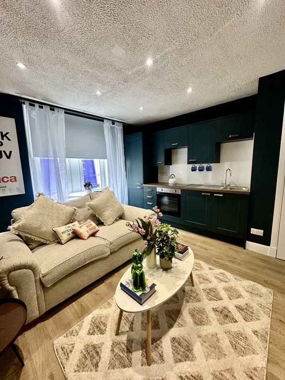 Property photo 3 of 8 Living Room (B)