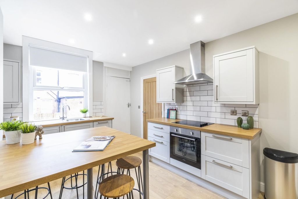 Property photo 2 of 11 Bright, Modern Kitchen With A Central Breakfast Is...