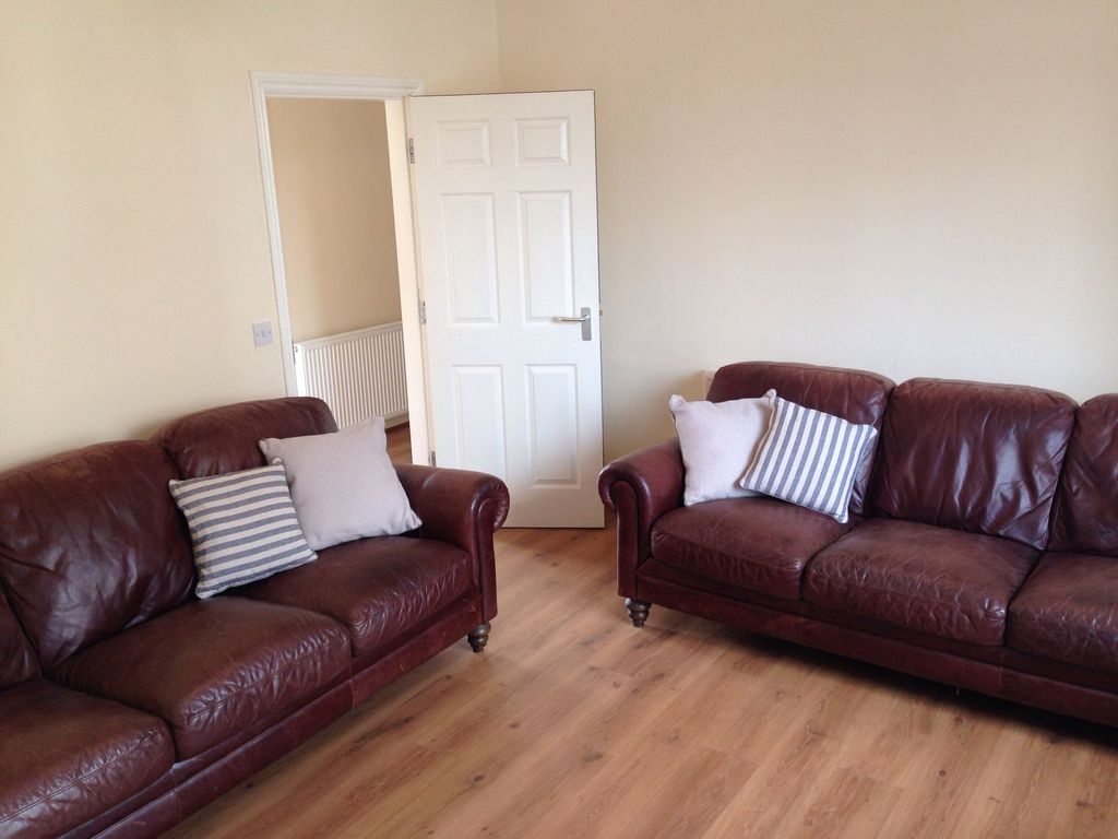Property photo 3 of 7 A Cozy Living Room Featuring Two Comfortable Brown...