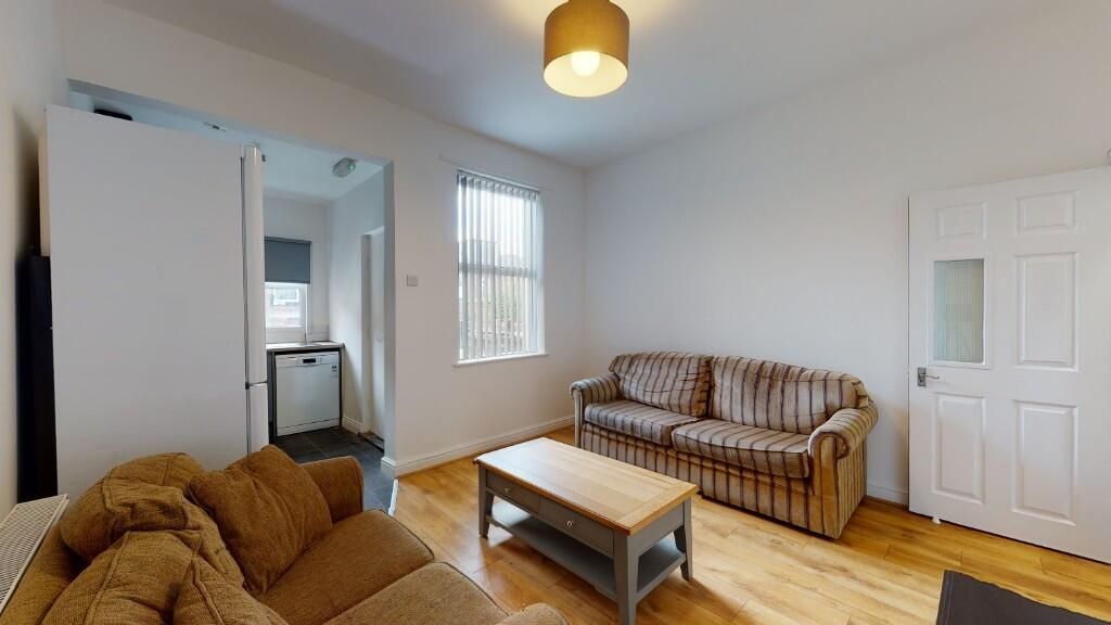 Property photo 1 of 5 A Bright And Welcoming Living Room Featuring Comfo...
