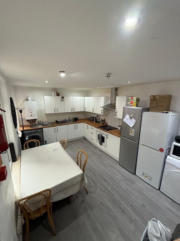 Property photo 1 of 11 A Well-Equipped Kitchen Featuring Ample Cabinetry ...