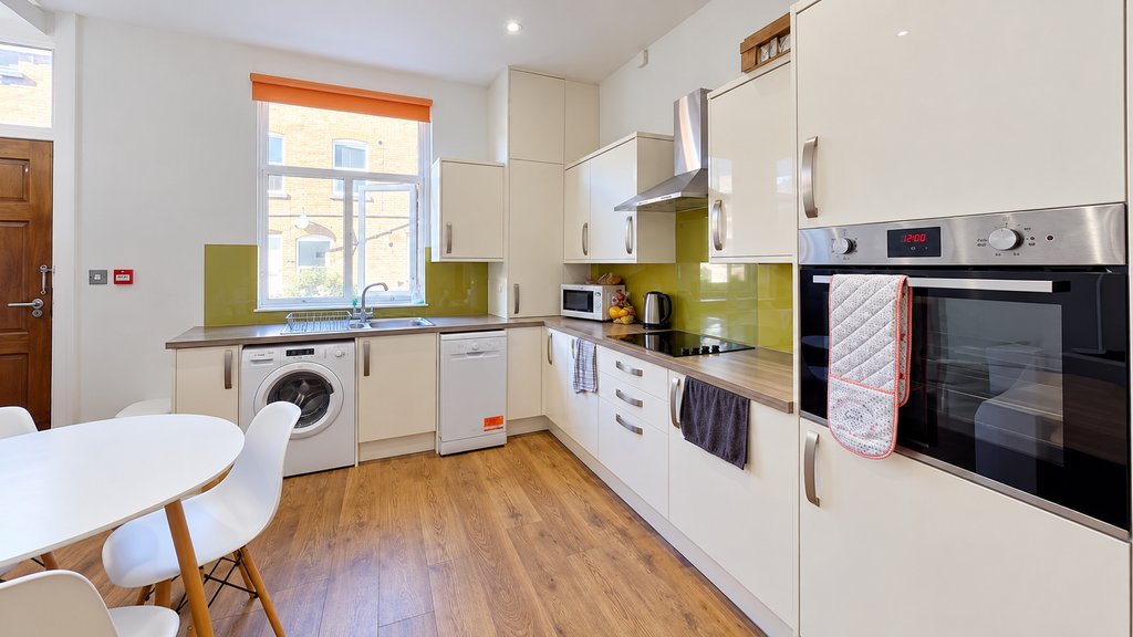 Property photo 2 of 12 Bright Modern Kitchen With Green Backsplash