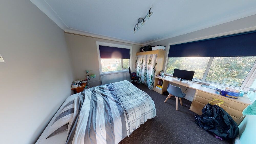 Property photo 3 of 10 A Cozy Single Bedroom Featuring A Comfortable Bed,...