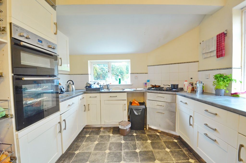 Property photo 3 of 7 Bright, Modern Kitchen With White Cabinetry, Integ...