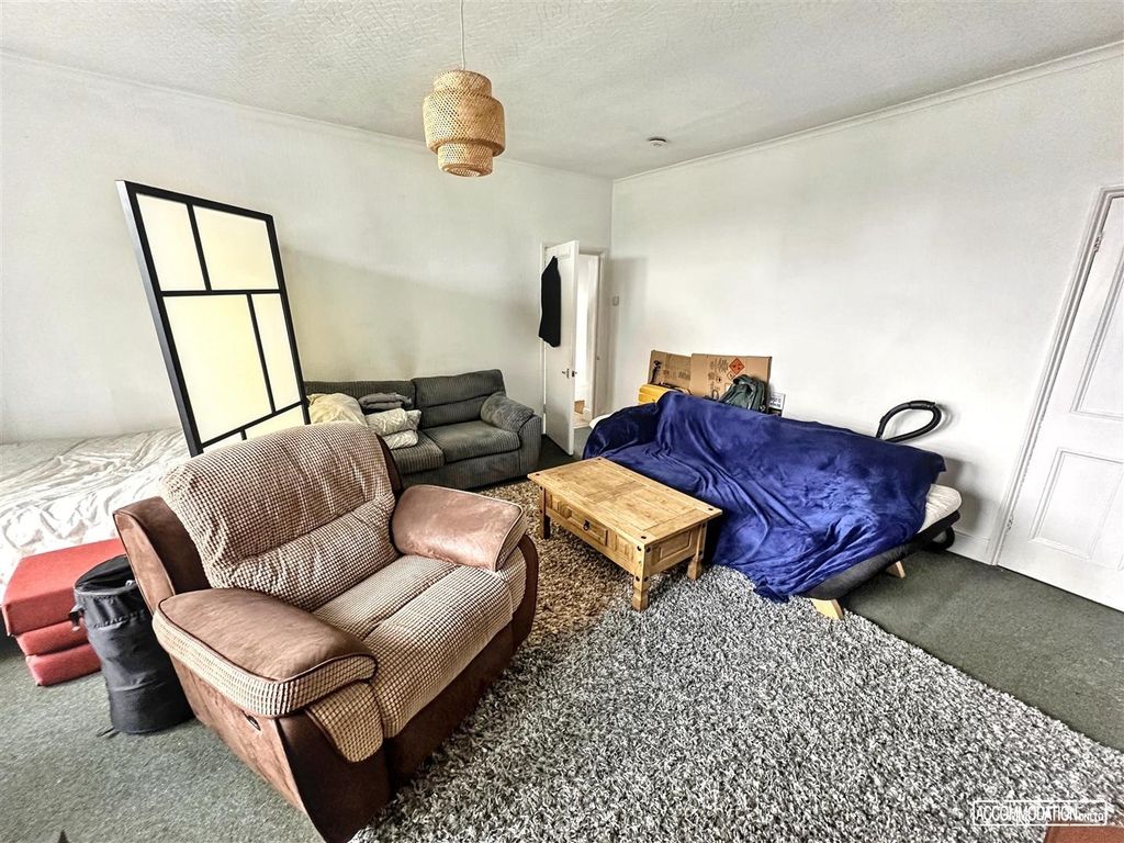 Property photo 3 of 8 Spacious Living Area With Comfortable Seating...