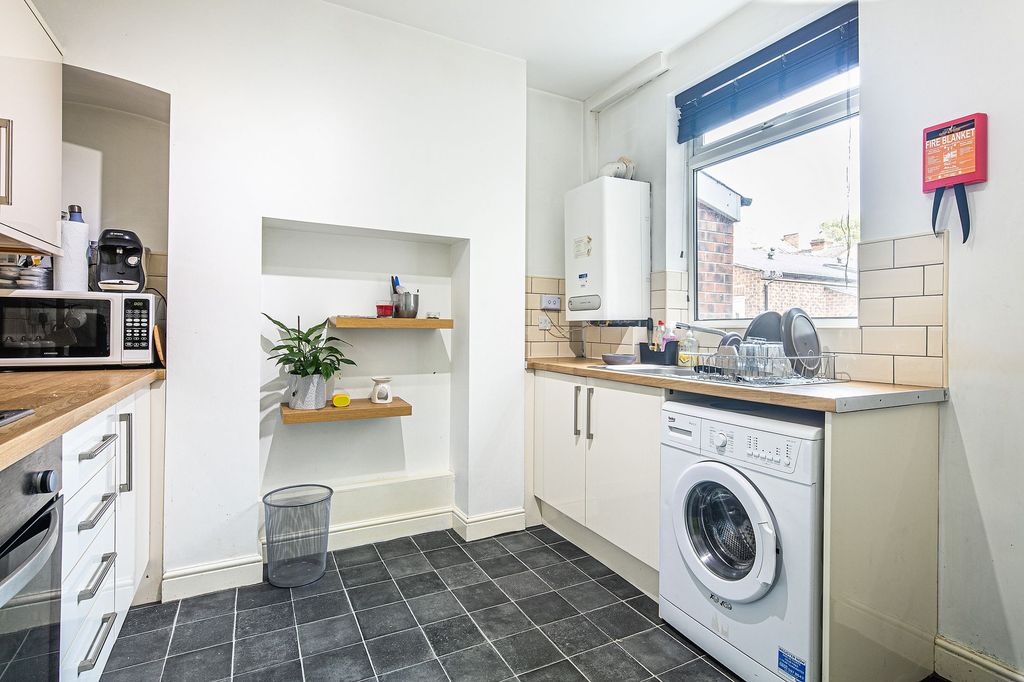 Property photo 3 of 5 Bright And Modern Kitchen Featuring White Cabinets...