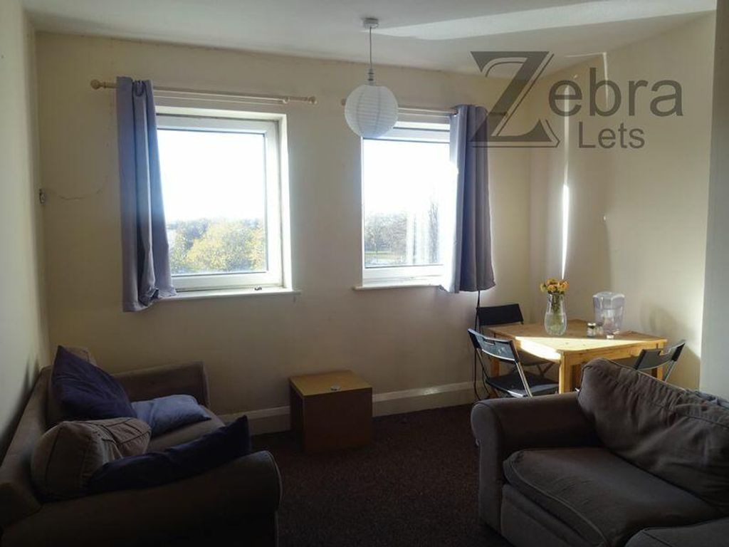 Property photo 2 of 13 A Bright And Inviting Living Room With Ample Natur...