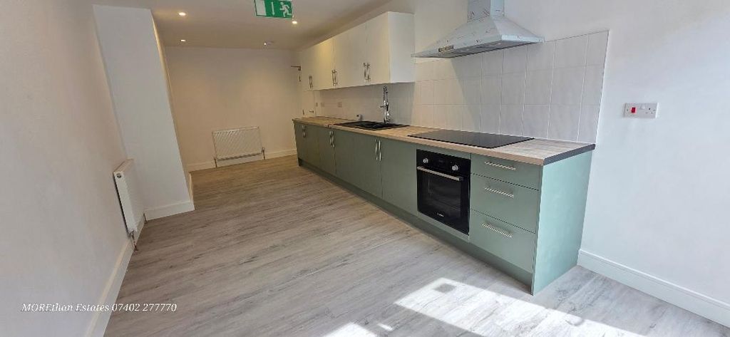 Property photo 3 of 12 Modern Kitchen With Sleek Sage Green Cabinetry...