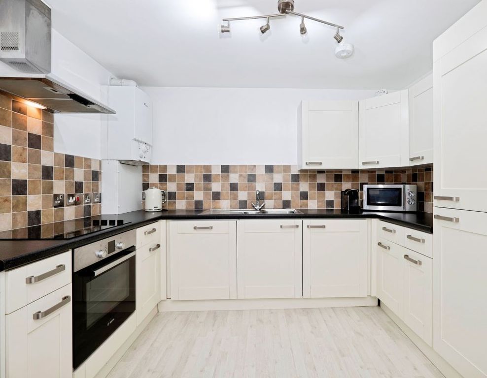 Property photo 2 of 6 Kitchen Area