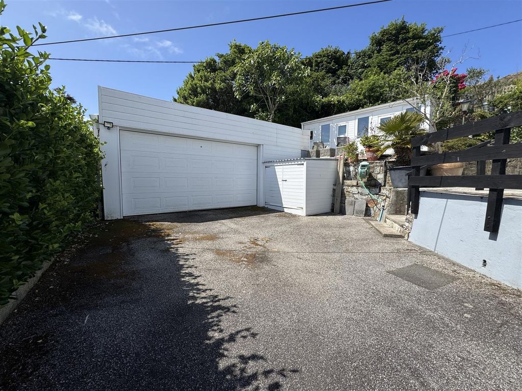 Property photo 2 of 24 Garage And Driveway