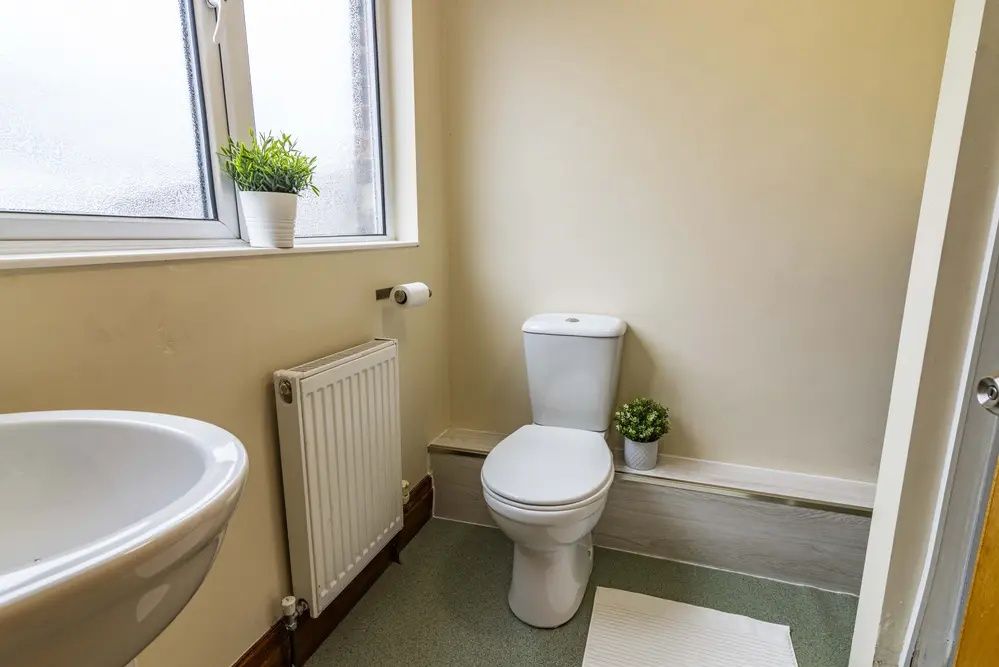 Property photo 2 of 10 Bright And Tidy Bathroom Featuring A White Toilet ...