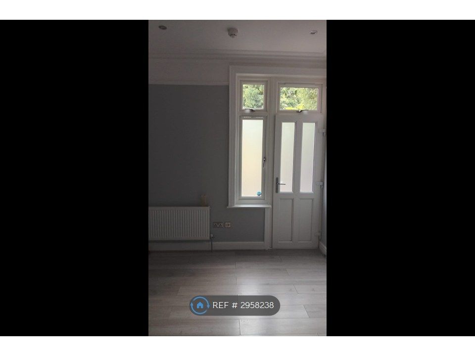 Property photo 2 of 6 Front Door/Living Room
