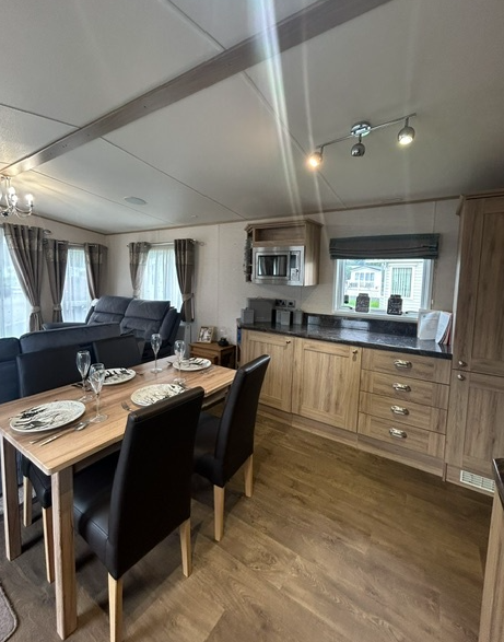 Property photo 2 of 7 Abi Ambleside Open Plan Kitchen And Dining Area With Wood Effect Cabinets