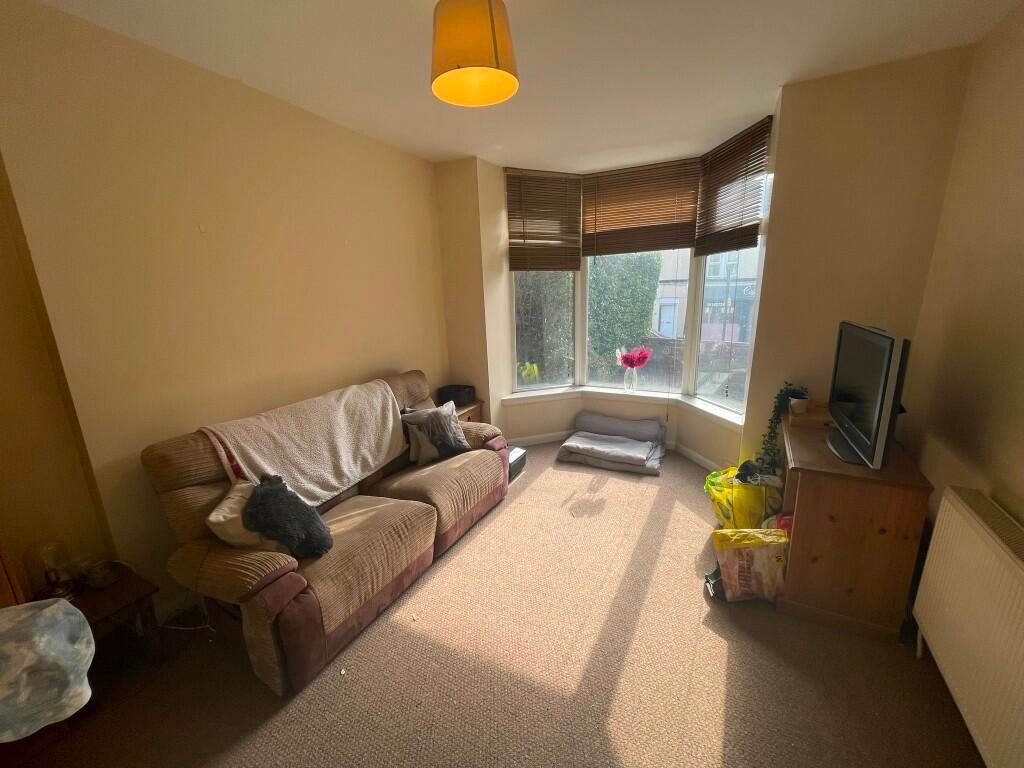 Property photo 3 of 9 A Cozy Living Room With A Comfortable Brown Sofa, ...