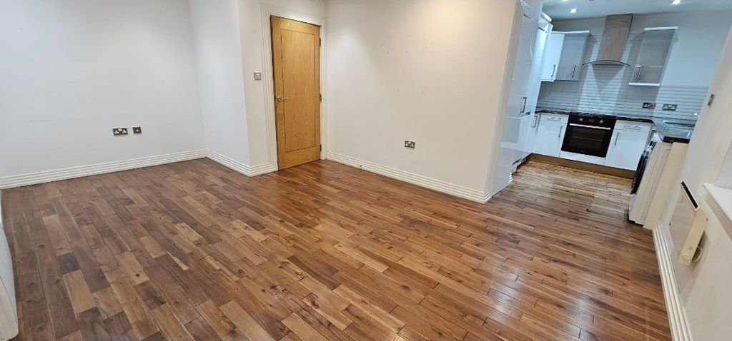 Property photo 1 of 15 Bright Open-Plan Living Area With Warm Wood Floori...