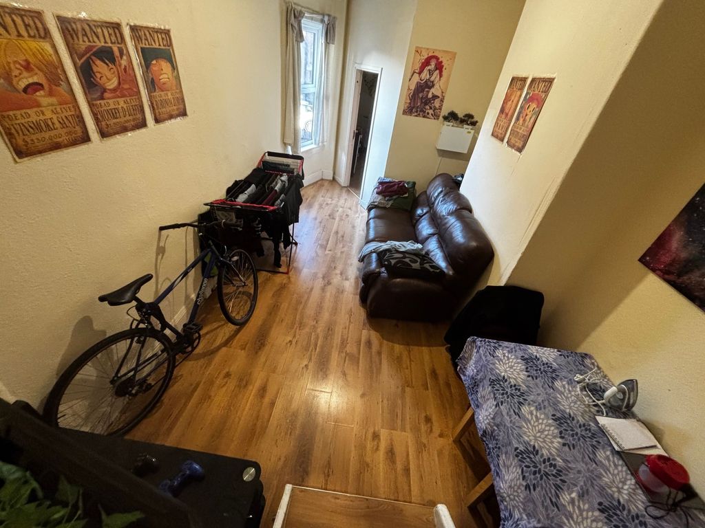 Property photo 3 of 5 Long, Narrow Living Area With Wood-Effect Flooring...