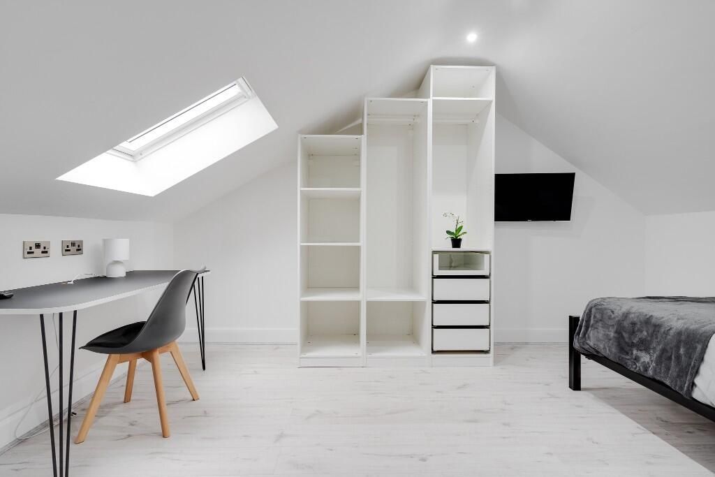 Property photo 1 of 14 Bright, Modern Attic Bedroom With Clean White Deco...