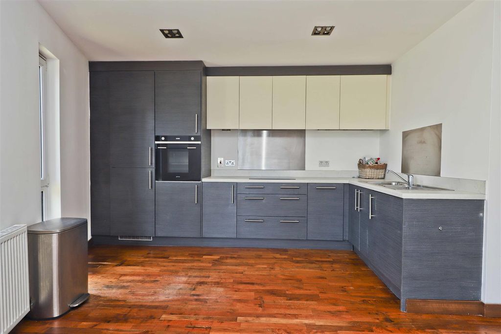Property photo 3 of 12 Kitchen Area