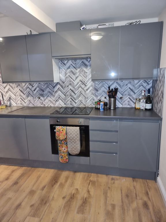 Property photo 1 of 7 Modern Fitted Kitchen With Glossy Grey Cabinets, P...