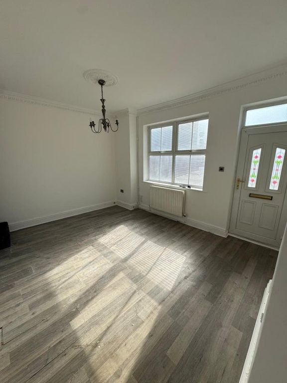 Property photo 2 of 9 Bright And Airy Living Room Featuring Large Window...