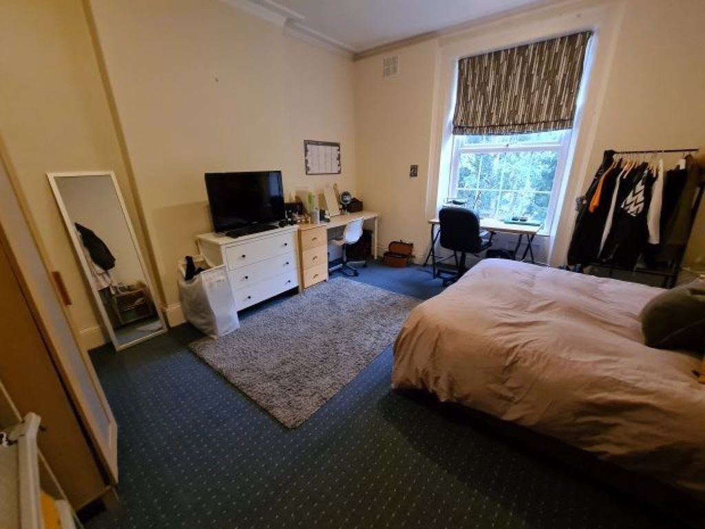 Property photo 2 of 16 A Bright And Cozy Bedroom Featuring A Comfortable ...