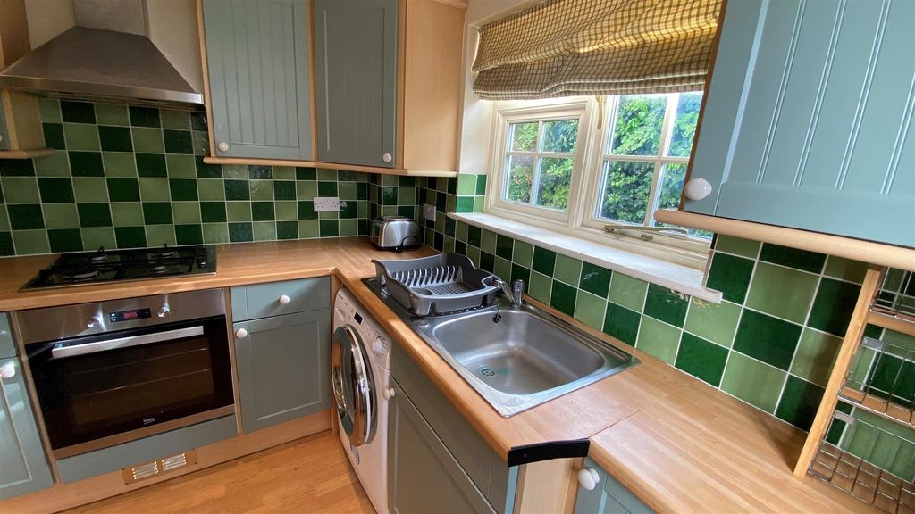 Property photo 3 of 25 Charming Kitchen With Vibrant Green Tiled Splash...