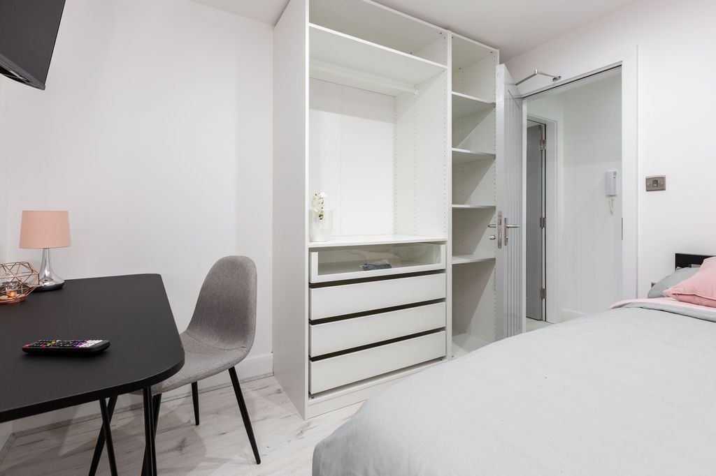 Property photo 2 of 5 A Modern, Bright Bedroom With A Neatly Arranged Wh...