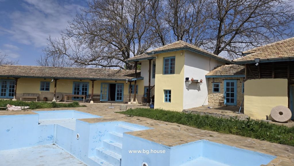 Property photo 2 of 99 Yellow Rural House With Blue Doors And Windows Beside An Empty Blue Swimming Pool