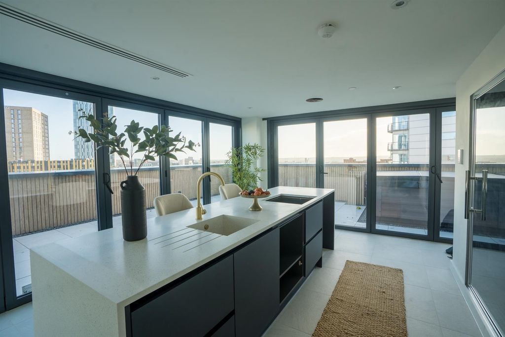 Property photo 2 of 11 Sleek Modern Kitchen With Bright Floor-To-Ceiling ...