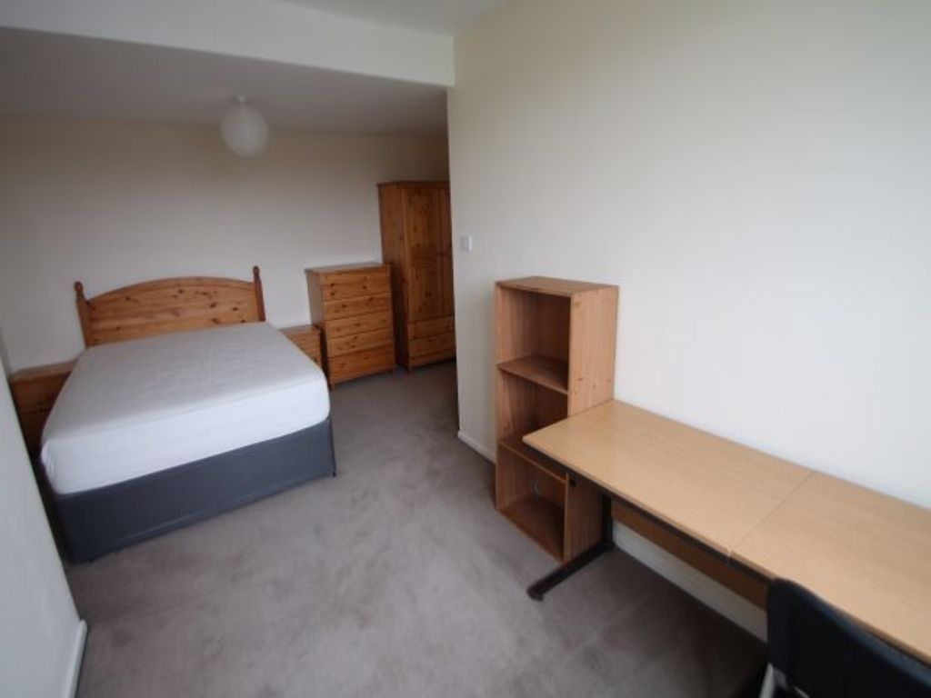 Property photo 1 of 22 A Tidy And Functional Bedroom Featuring A Comforta...