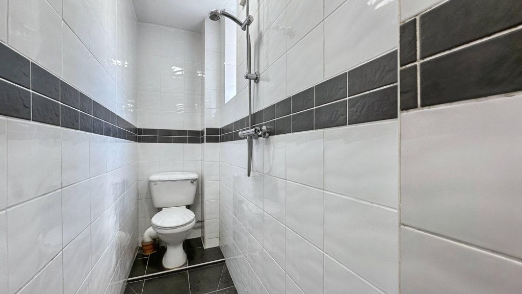 Property photo 1 of 10 Bright Modern Shower Room With Stylish Tiling...