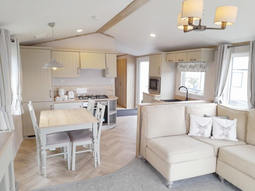 Property photo 3 of 12 Spacious Open Plan Living Area With Accessible Kitchen And Dining Space