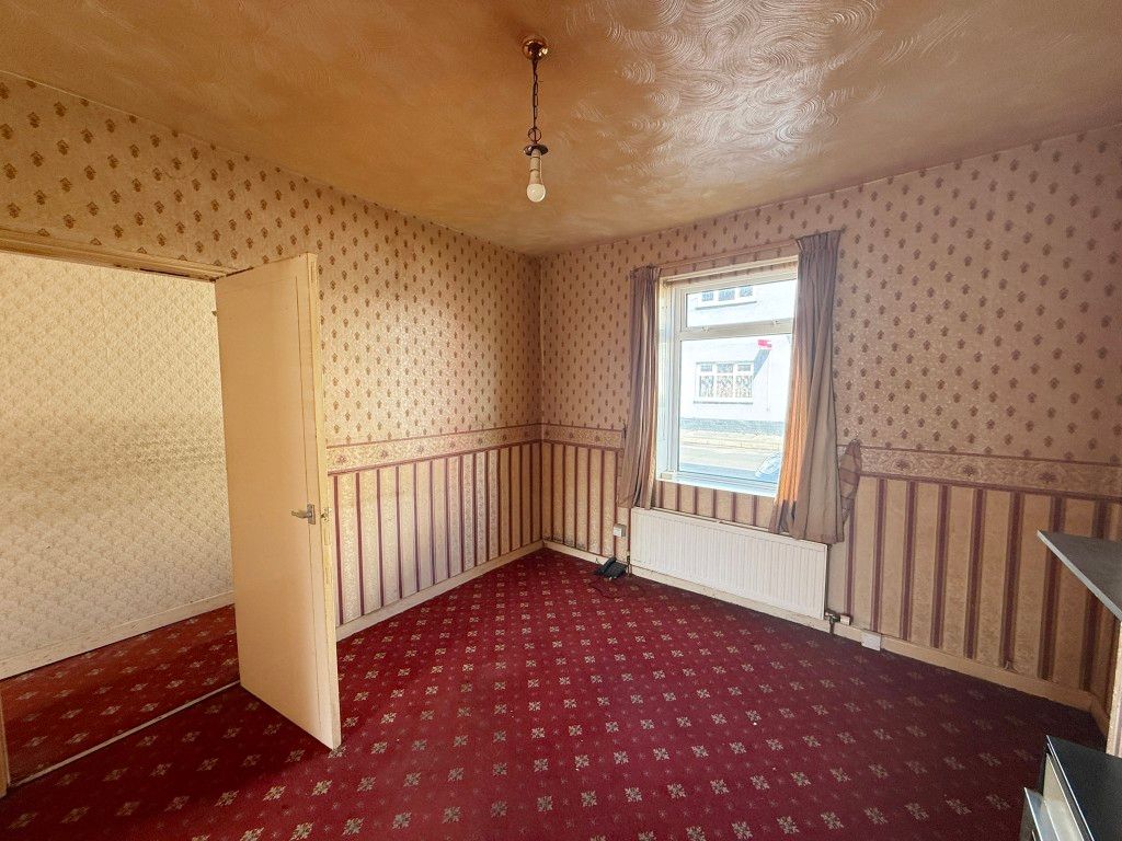 Property photo 3 of 11 Living Room With Carpet And Wallpaper