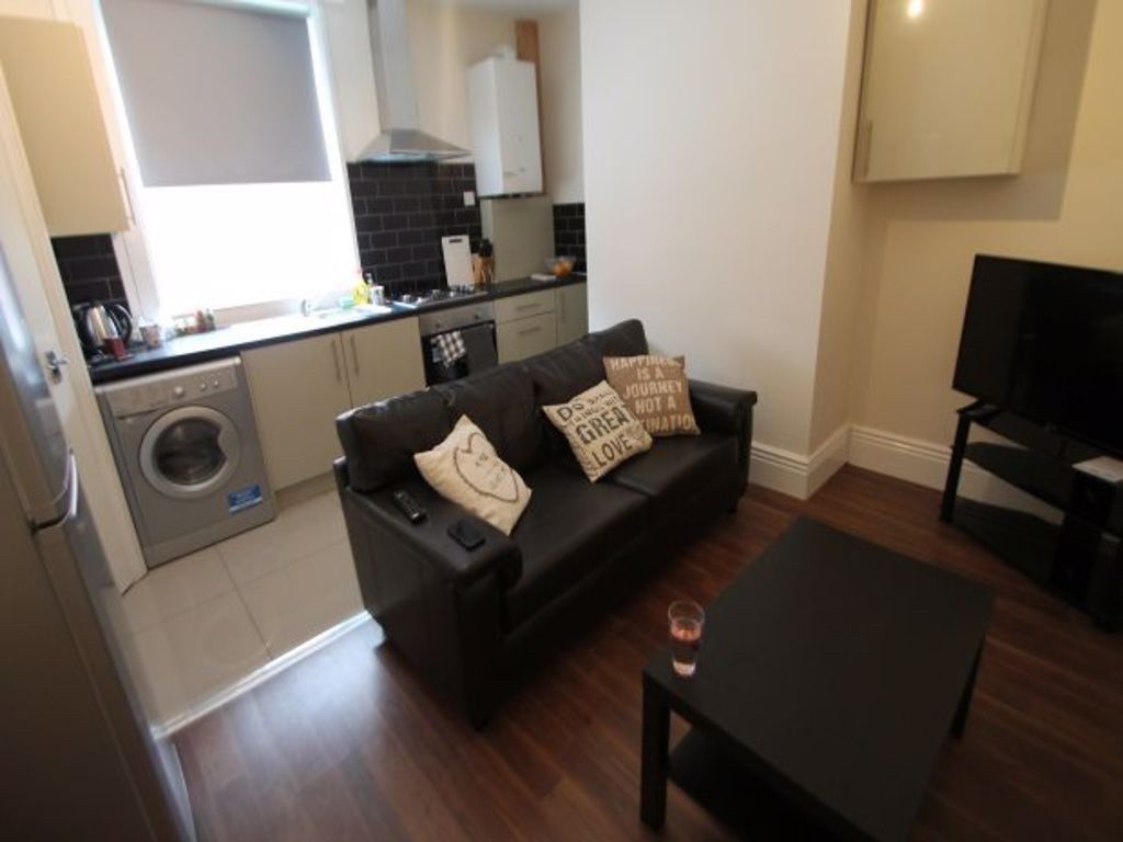 Property photo 3 of 4 A Cozy And Well-Maintained Living Room Featuring A...