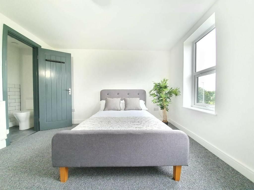 Property photo 2 of 7 Bright And Spacious Master Bedroom Featuring A Com...