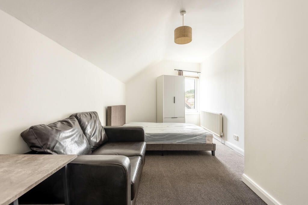 Property photo 1 of 11 A Bright And Airy Master Bedroom Featuring A Comfo...