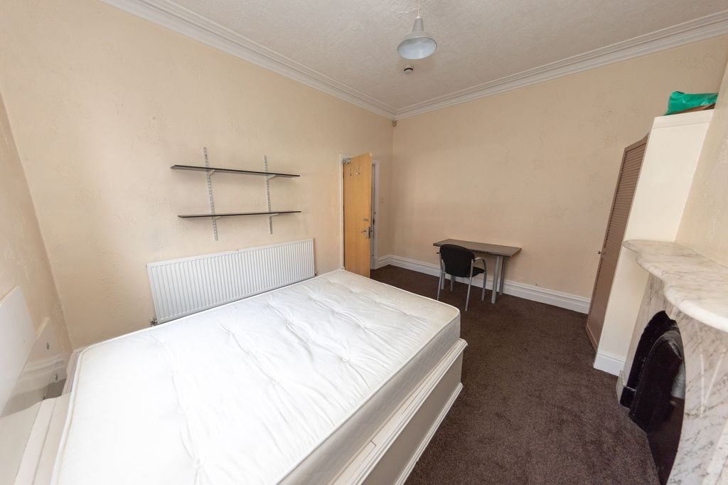 Property photo 3 of 7 A Cozy Bedroom Featuring A Double Bed, Neutral Wal...