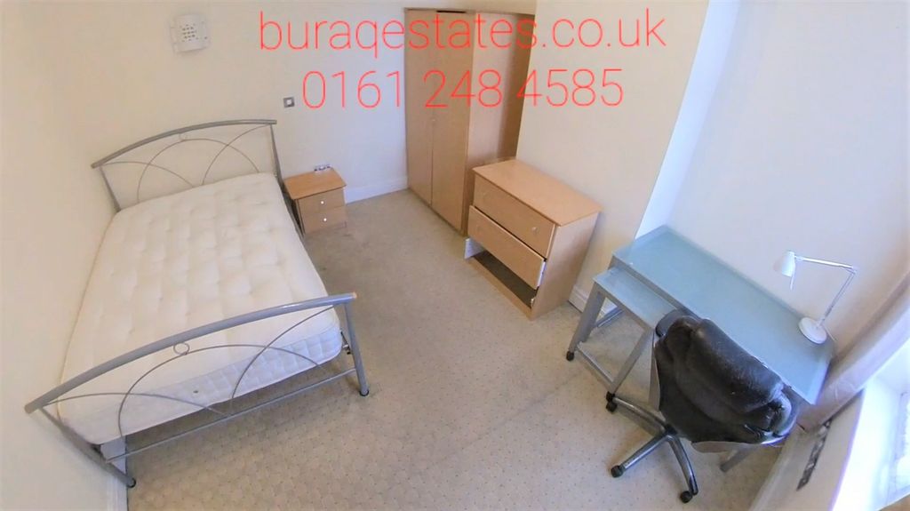 Property photo 3 of 15 A Neatly Arranged Single Bedroom Featuring A Metal...