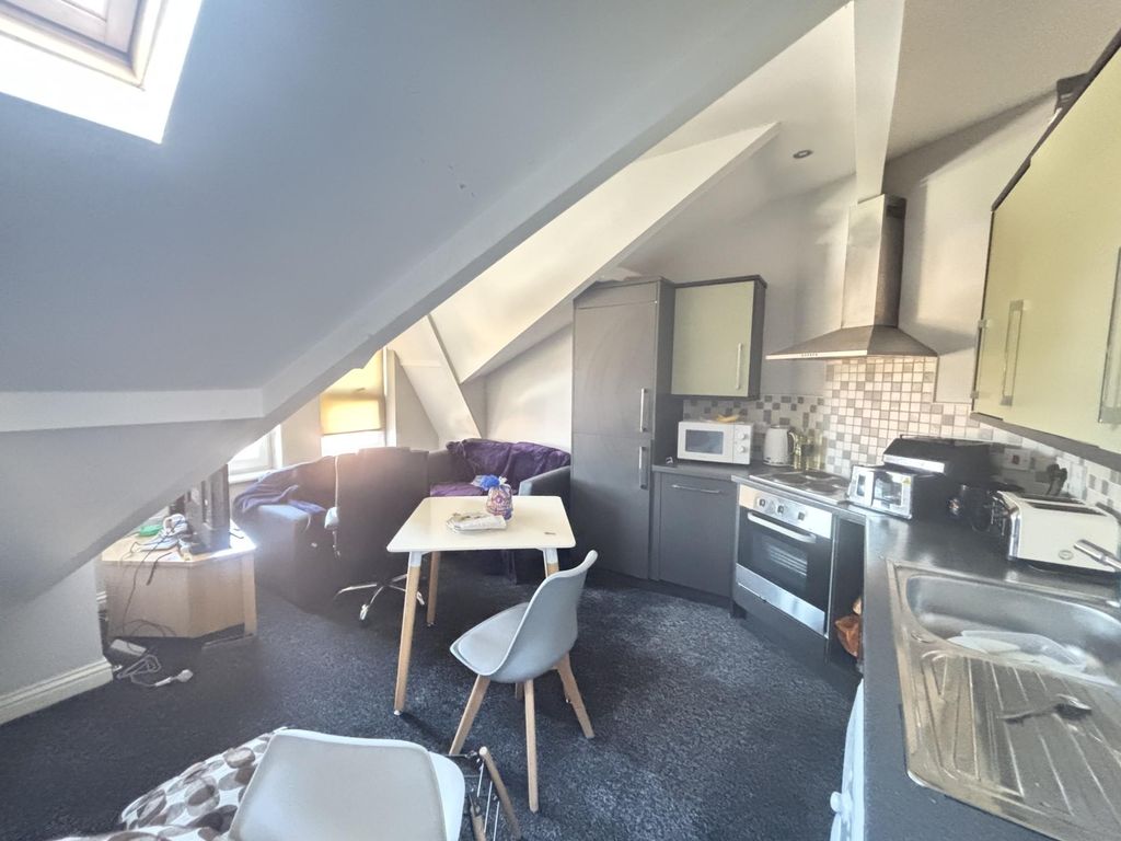 Property photo 3 of 9 Bright And Inviting Living Area With Natural Light...