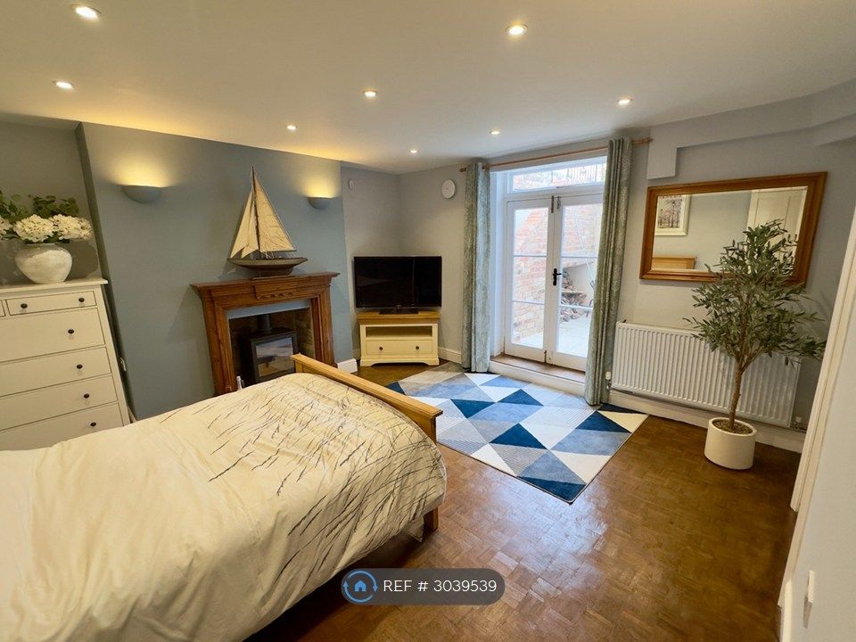 Property photo 2 of 12 Bright Main Living Area With French Doors