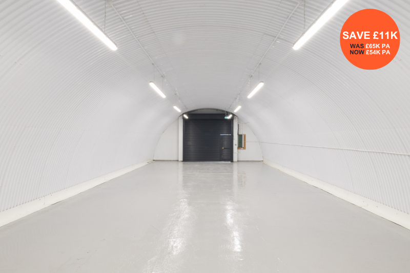 Property photo 3 of 3 The Front Of An Arch, With High Level Glazing, An Open Electric Roller Shutter Entrance Big Enough For Vehicle Access, And A Pedestrian Door.