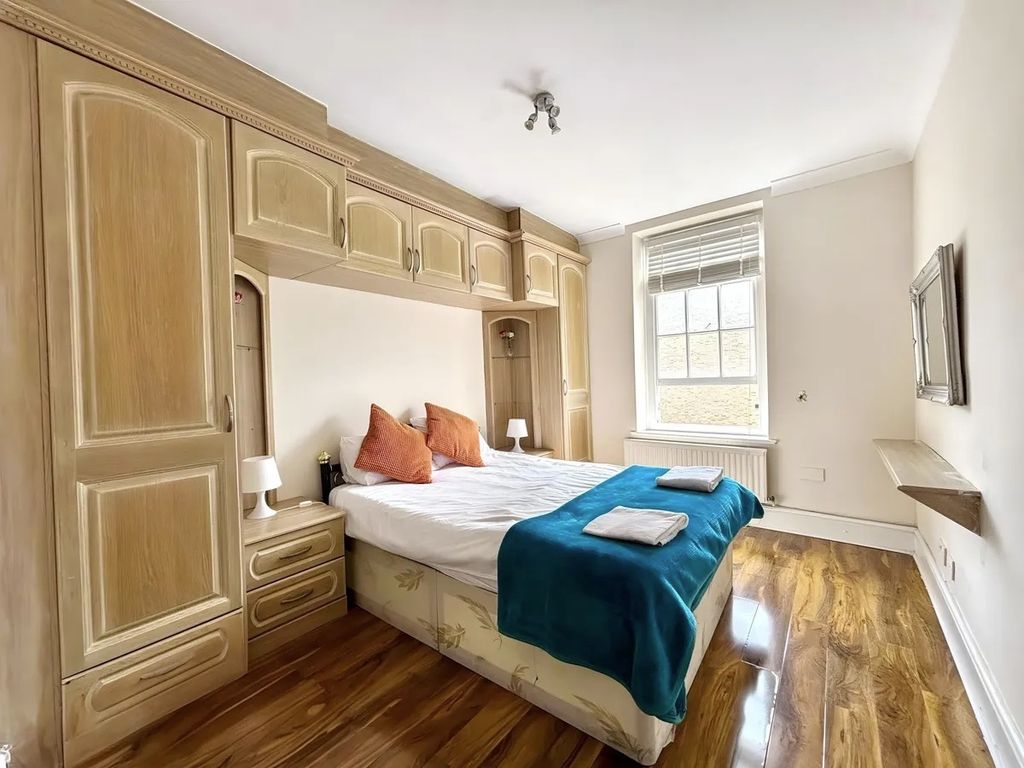 Property photo 2 of 8 Bright Bedroom With Extensive Built-In Storage...