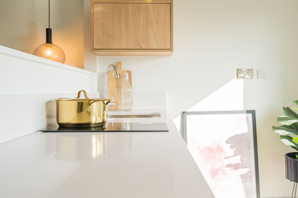 Property photo 2 of 7 Bright And Modern Kitchen Space Featuring A Sleek ...