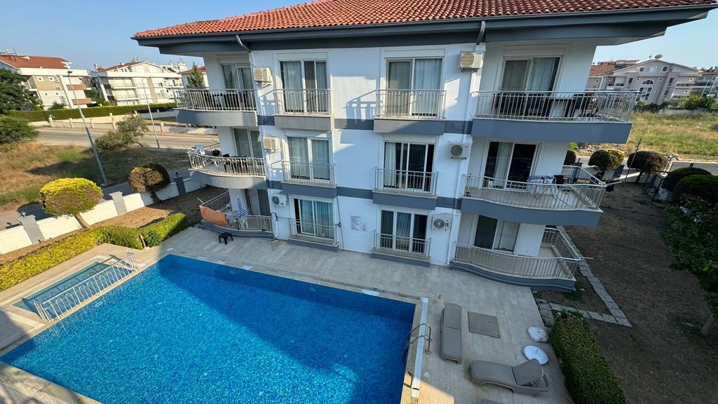 Property photo 1 of 12 Spotless Apartment In Antalya For Sale - Main View Of The Apartment Complex And Communal Swimming Pool