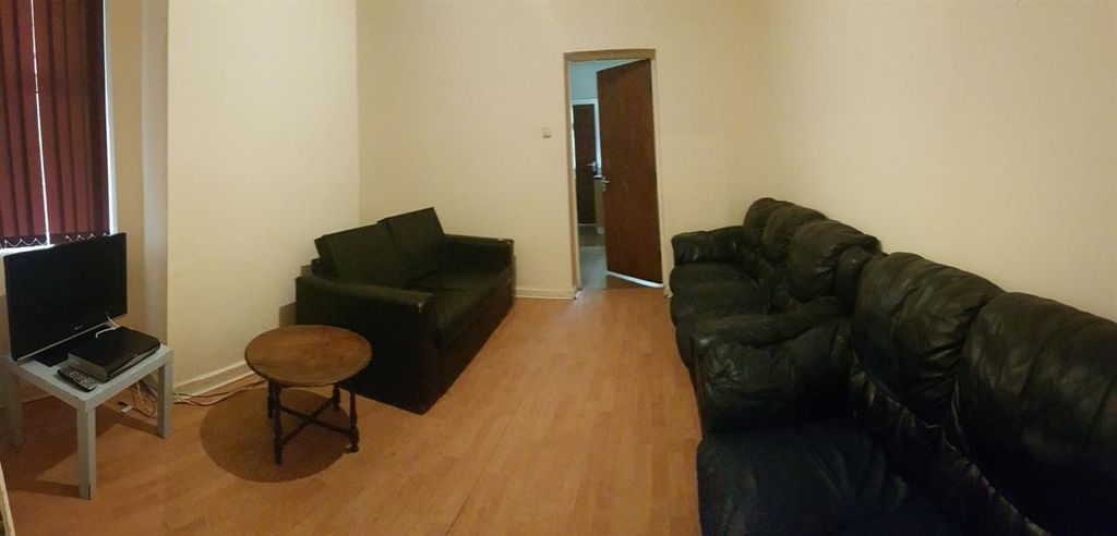 Property photo 1 of 13 A Spacious, Well-Lit Living Room With Comfortable ...